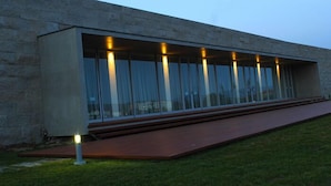 A modern building with large glass windows and a concrete facade. - Lousada Country Hotel (Lousada)