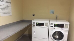 A laundry area with two washing machines and a sign indicating it's for guest use only. - Holiday Inn Express & Suites Tahlequah by IHG (Tahlequah)