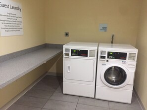 A laundry area with two washing machines and a sign indicating it's for guest use only. - Holiday Inn Express & Suites Tahlequah by IHG (Tahlequah)
