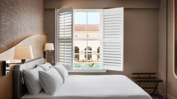 Deluxe Room, 1 King Bed, Pool View | In-room safe, desk, laptop workspace, iron/ironing board