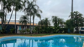 Outdoor pool, open 7:00 AM to 8:00 PM, pool loungers