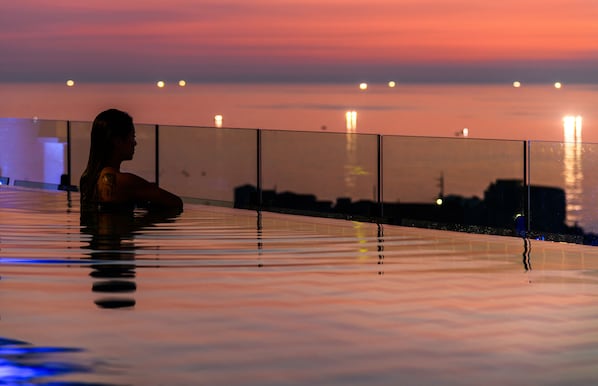 Outdoor pool, open 11:00 AM to 10:00 PM, cabanas (surcharge)