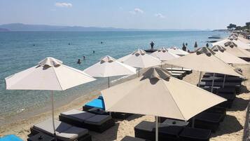 On the beach, sun loungers