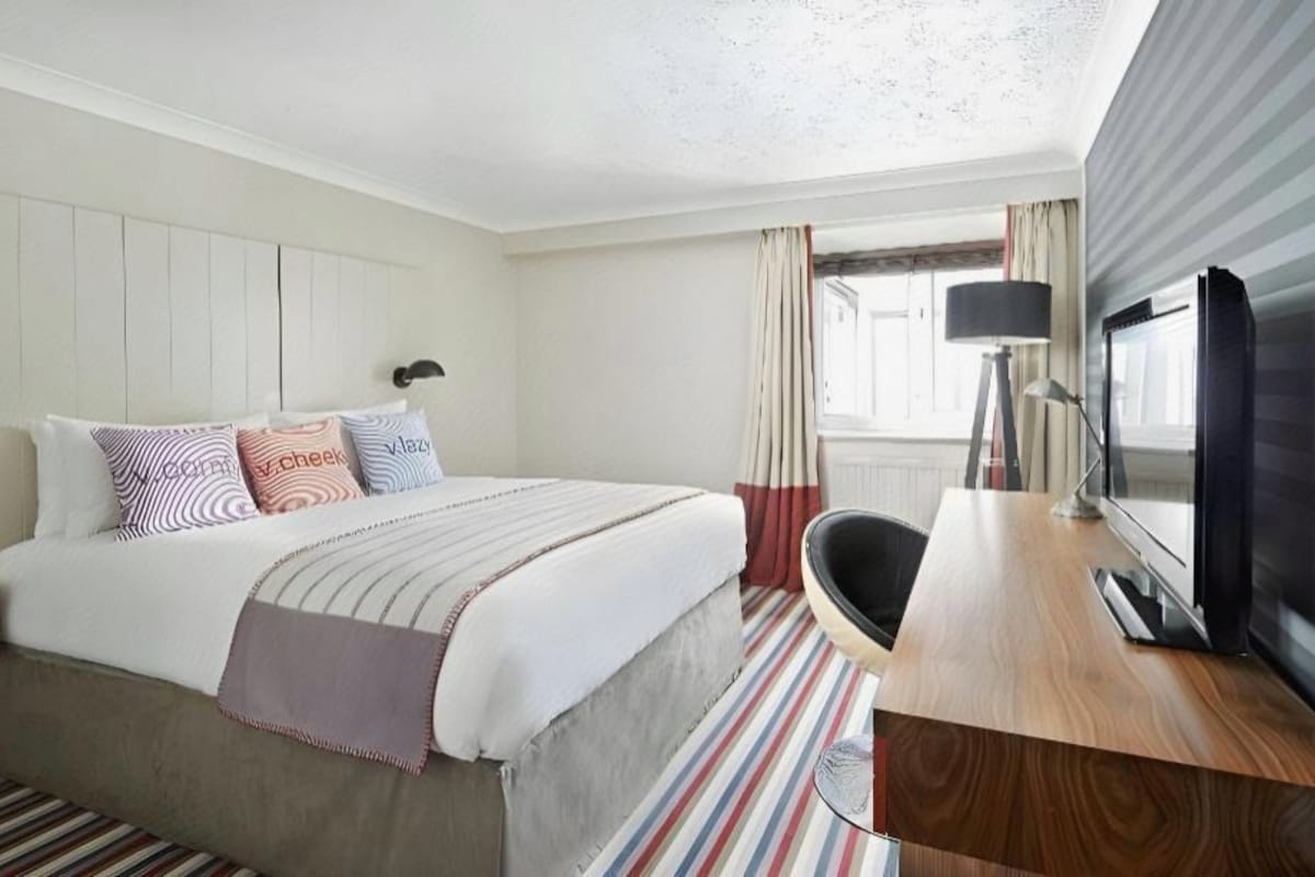 Desk, laptop workspace, blackout curtains, iron/ironing board