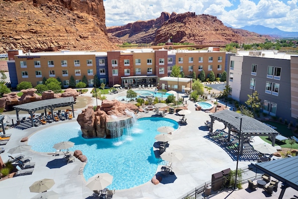 Seasonal outdoor pool, open 8:00 AM to 10:00 PM, pool umbrellas