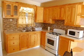 Apartment, 2 Bedrooms | Private kitchen | Full-size fridge, microwave, stovetop, cookware/dishes/utensils - The Terraces at Mangrove (Mangrove)