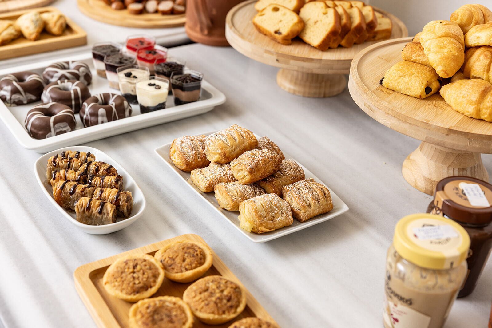 A variety of pastries and desserts on a table.
