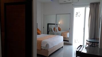 Habitación Deluxe | Minibar, caja de seguridad en la habitación, escritorio y wifi gratis