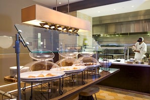 Daily buffet breakfast (USD 18.00 per person)