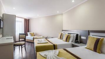 Deluxe Quadruple Room | Premium bedding, minibar, in-room safe, blackout curtains