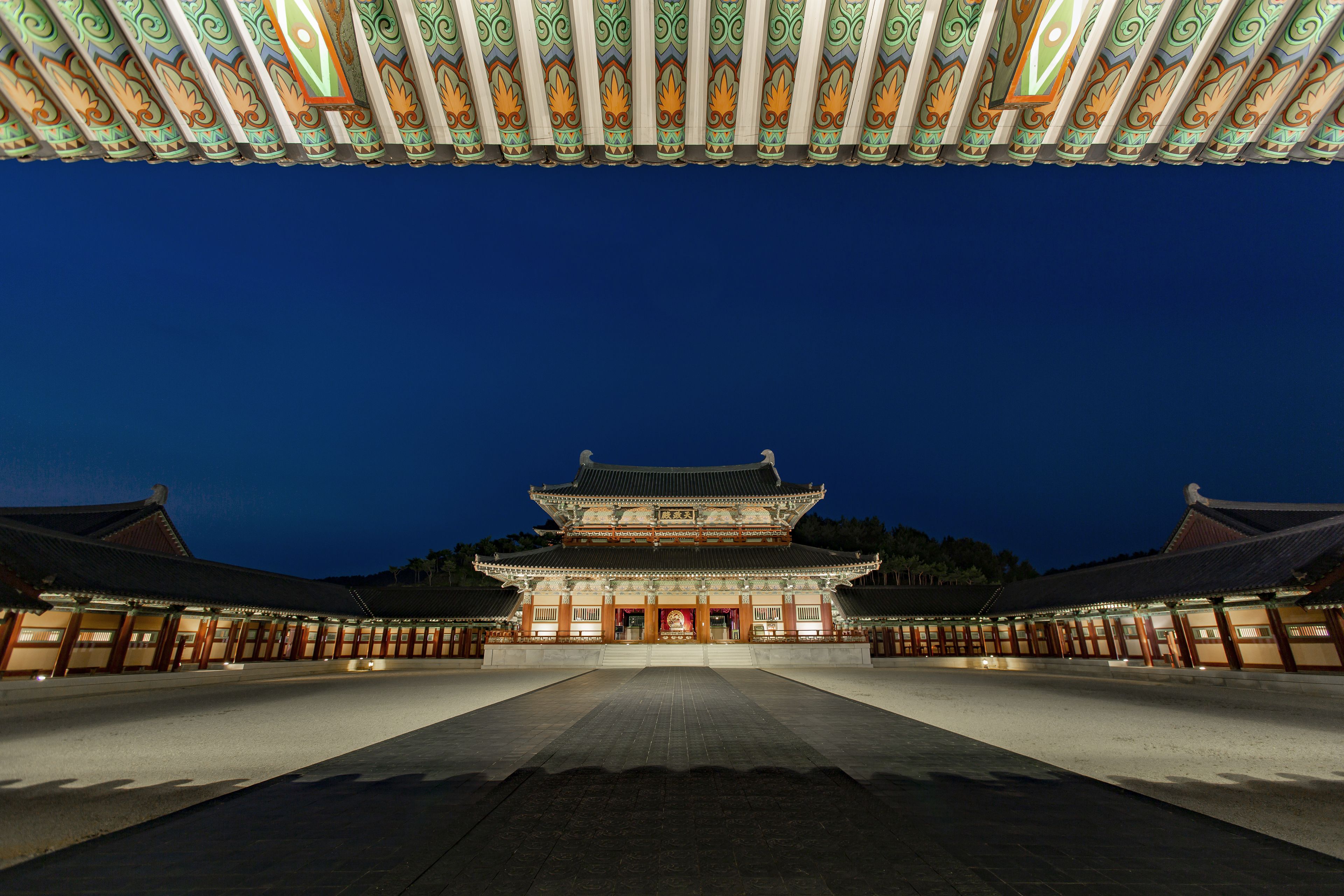 A traditional building with a symmetrical facade, large central entrance, and a tiled roof.
