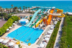 A water park with multiple slides and a swimming pool. - Bellis Deluxe Hotel (Serik)