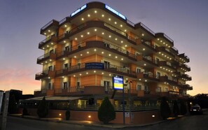 A multi-story hotel with balconies, a restaurant, and a sign indicating it is the Philoxenia Hotel. - Philoxenia Hotel (Chalcis)