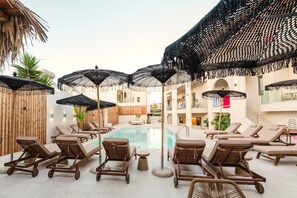 Indoor pool, seasonal outdoor pool, pool umbrellas, pool loungers