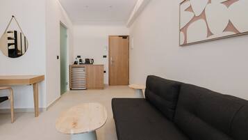 Serenity Suite Split Level with Private Pool & Sea View | Living area | 40-inch Smart TV with satellite channels, TV