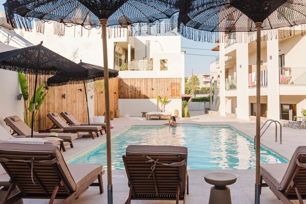 Indoor pool, seasonal outdoor pool, pool umbrellas, pool loungers