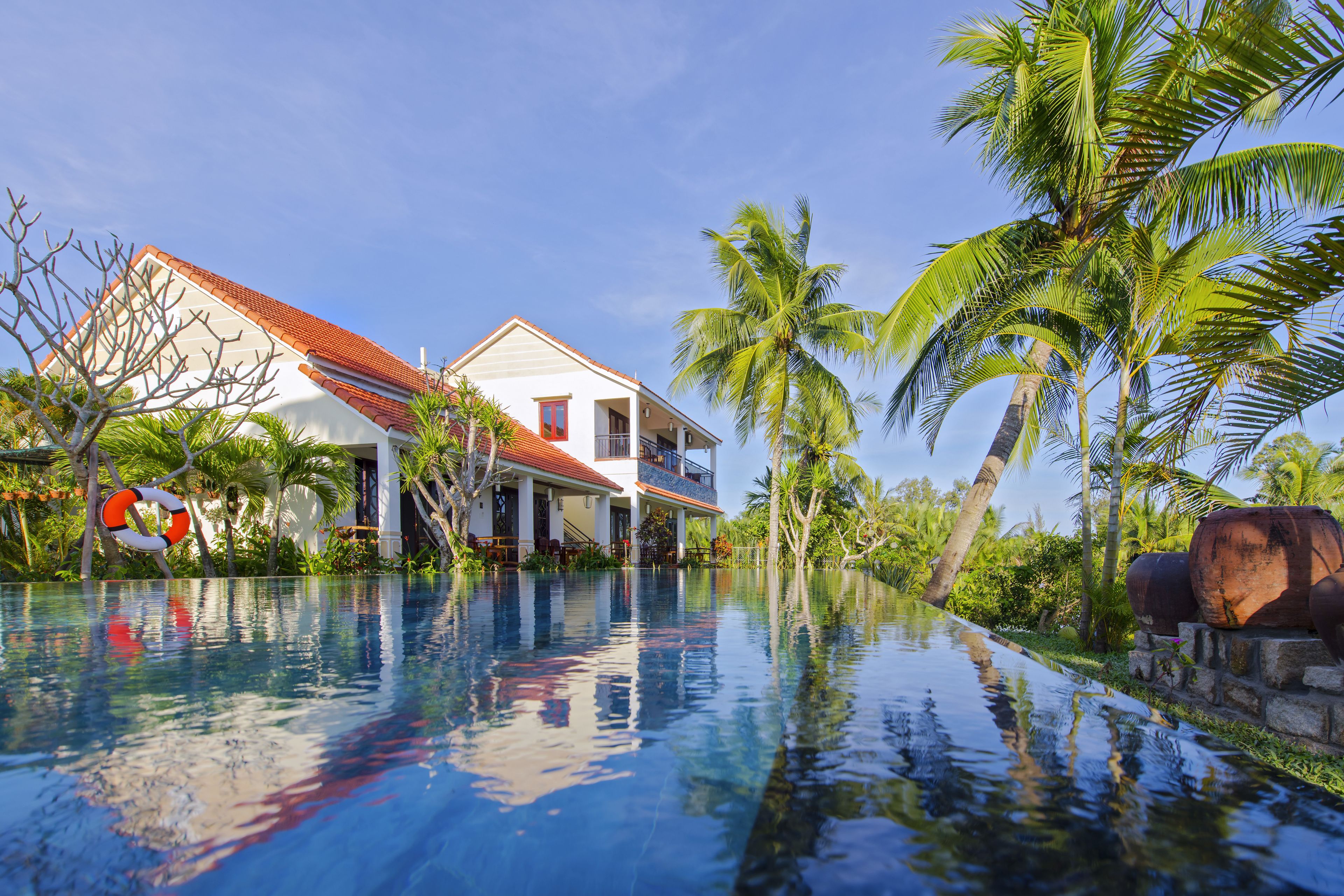 outdoor pool, an infinity pool, pool loungers
