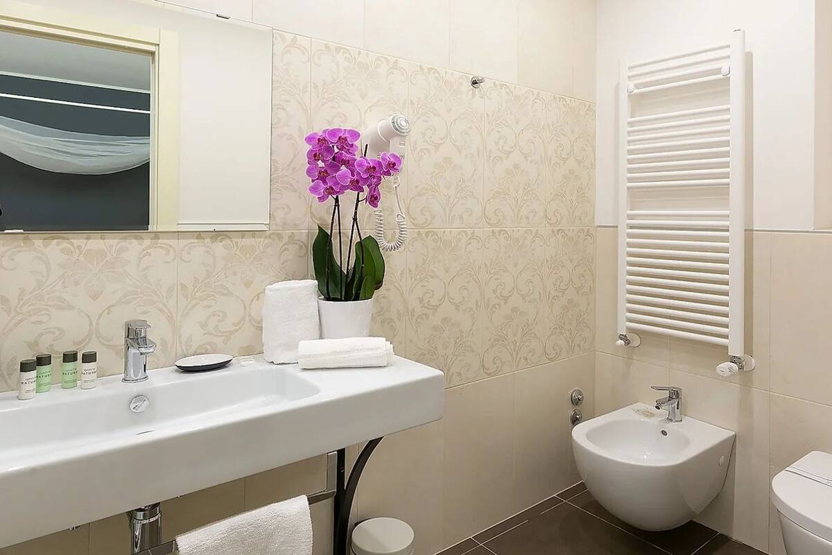 free toiletries, hair dryer, slippers, bidet