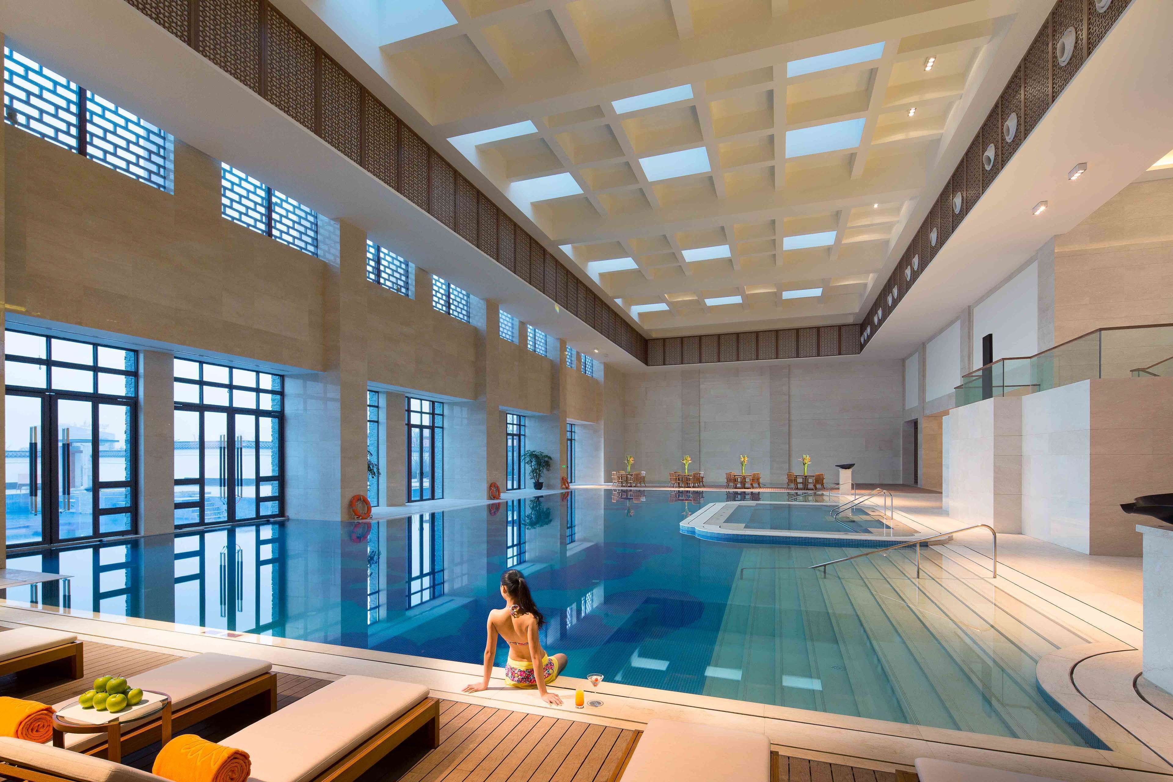 Indoor pool, outdoor pool, pool umbrellas, pool loungers