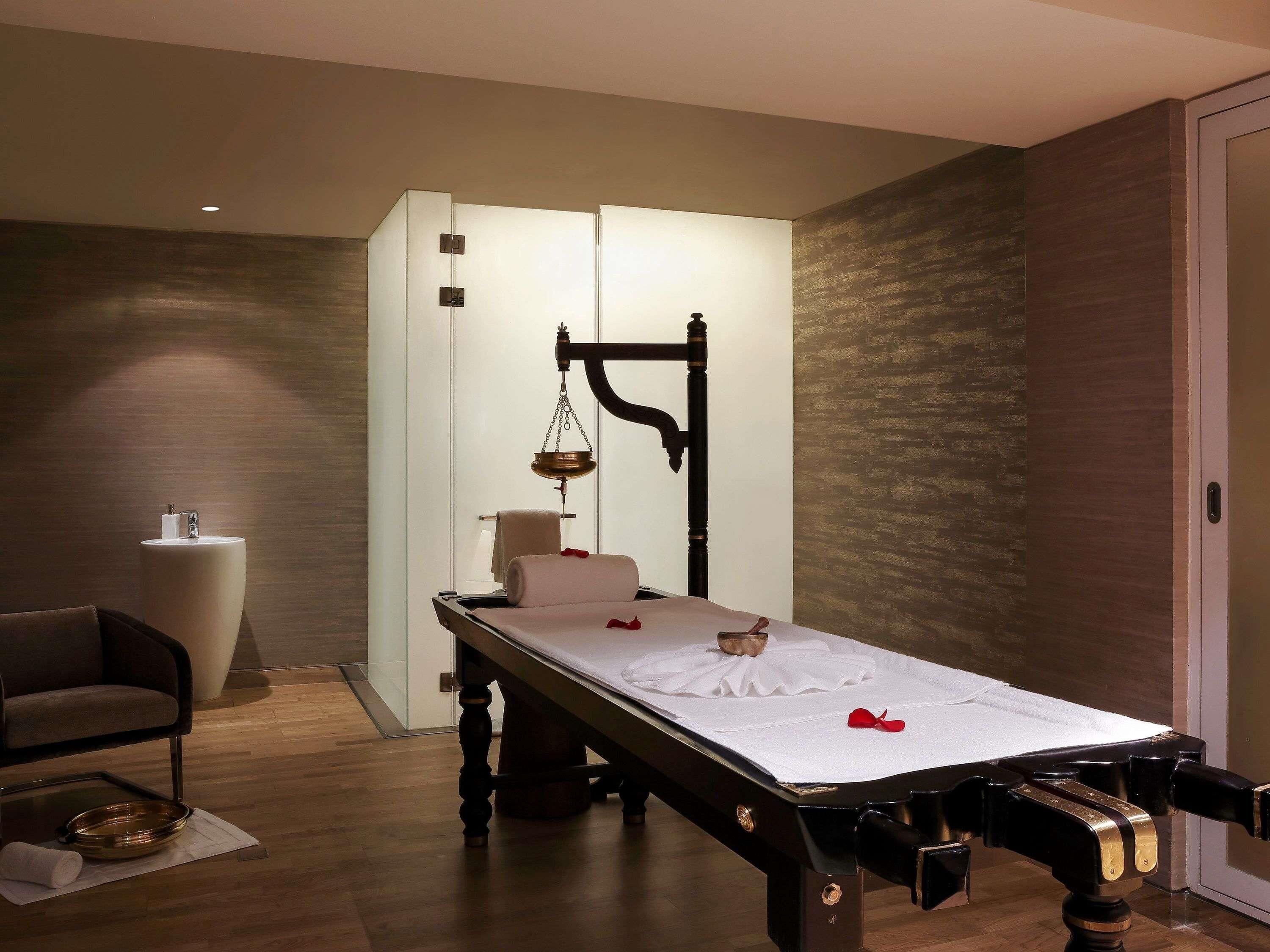 A modern room with a bed, a small table, and a chair.