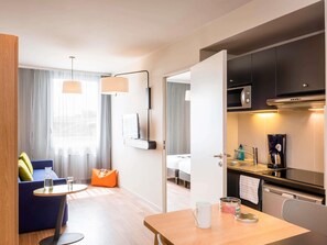 Apartment, 1 Bedroom | In-room safe, desk, iron/ironing board, free cribs/infant beds