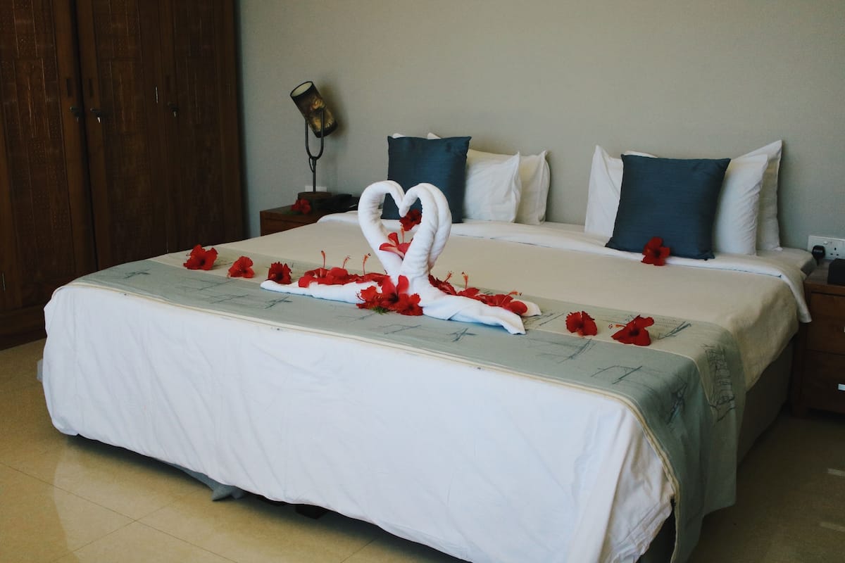 Deluxe Room, Sea View | Minibar, in-room safe, blackout curtains, free WiFi
