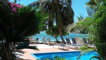 Outdoor pool, pool umbrellas, sun loungers