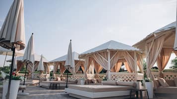 Indoor pool, outdoor pool, pool umbrellas, sun loungers