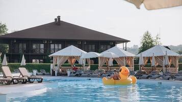 Indoor pool, outdoor pool, pool umbrellas, pool loungers