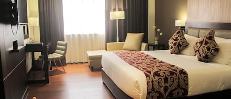 Premiere King | 1 bedroom, down comforters, minibar, in-room safe