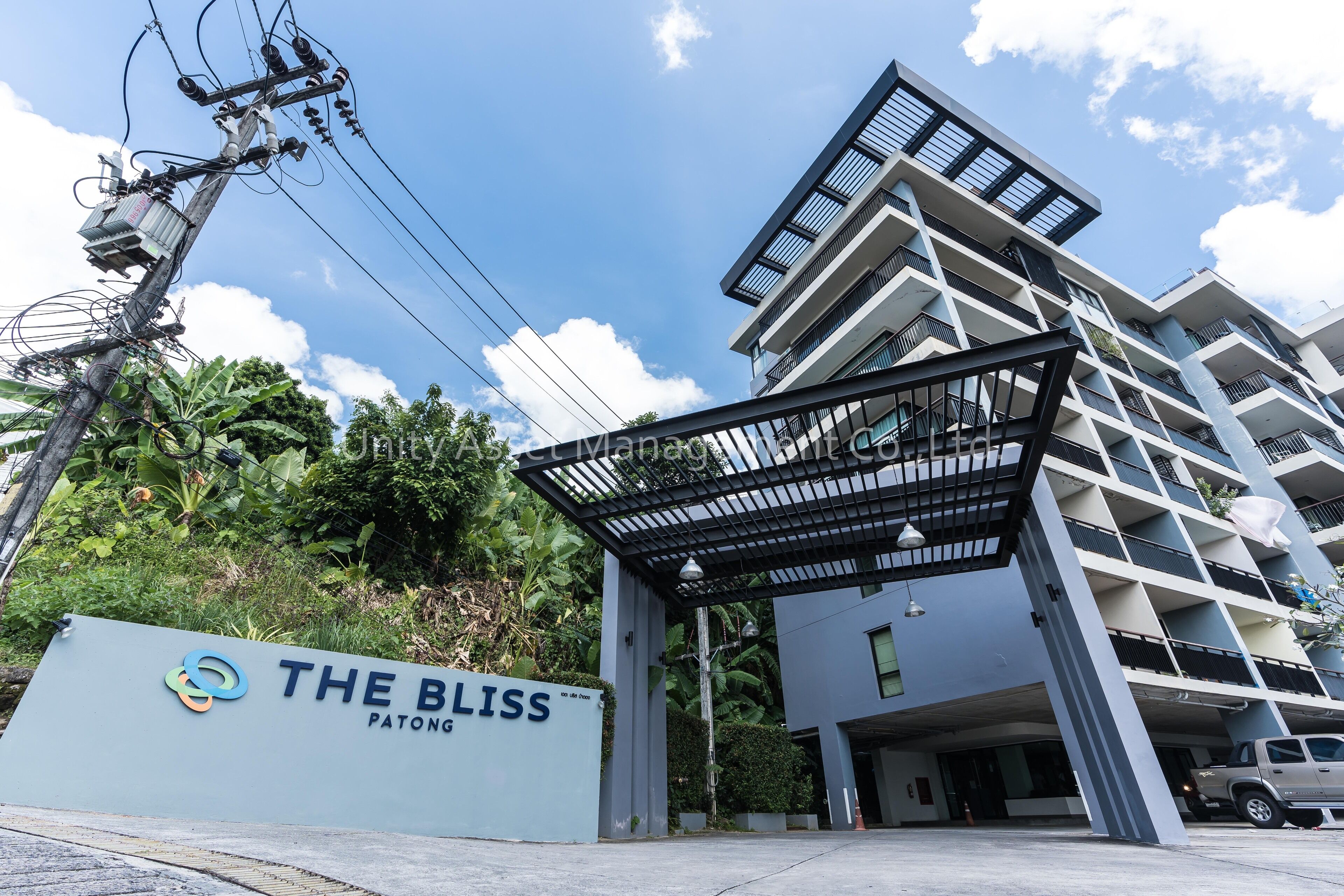 A modern building with a sign reading "THE BLISS PATONG".