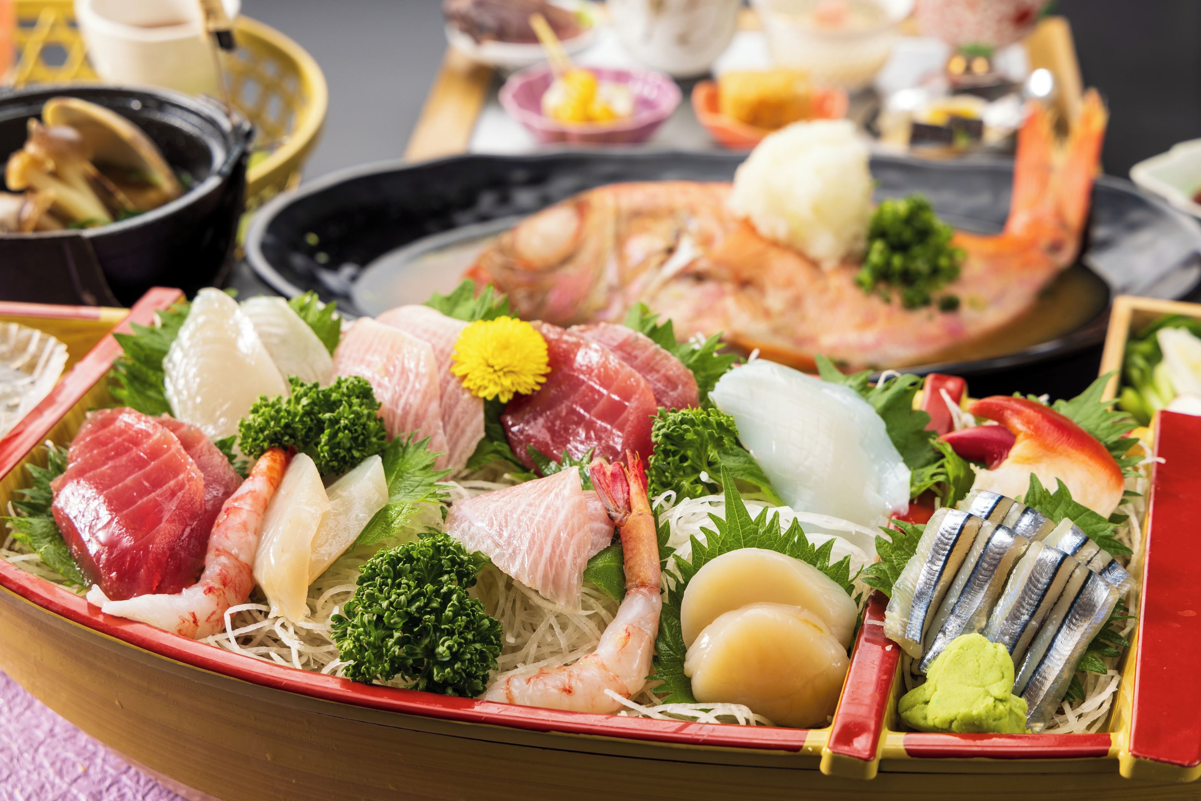 A variety of seafood arranged on a tray with different types of fish, shrimp, and other seafood items.