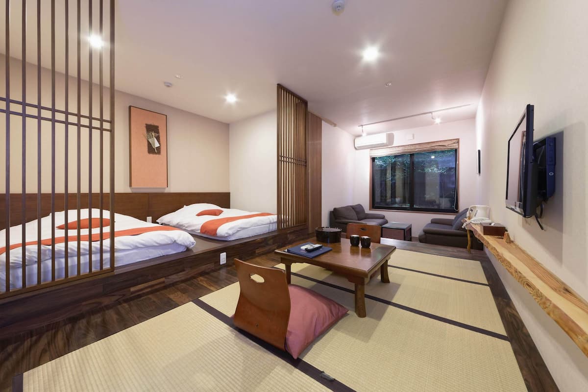 japanese western style room with living room and private open-air bath, non smoking (annex building) | 1 bedroom, in-room safe, free wifi, bed sheets