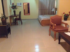 Executive Suite | Living room | 24-inch LCD TV with cable channels, TV, first-run films