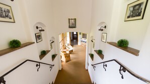 A staircase leading to a dining area with a view of the dining space.