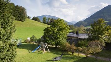 Escape to a serene natural haven surrounded by rolling hills and majestic mountains.