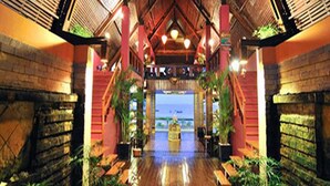 A wooden interior with a central pathway leading to a view of the sea. - Amata Resort & Spa (Ngapali)