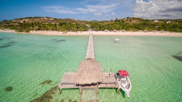 On the beach, white sand, beach umbrellas, beach towels