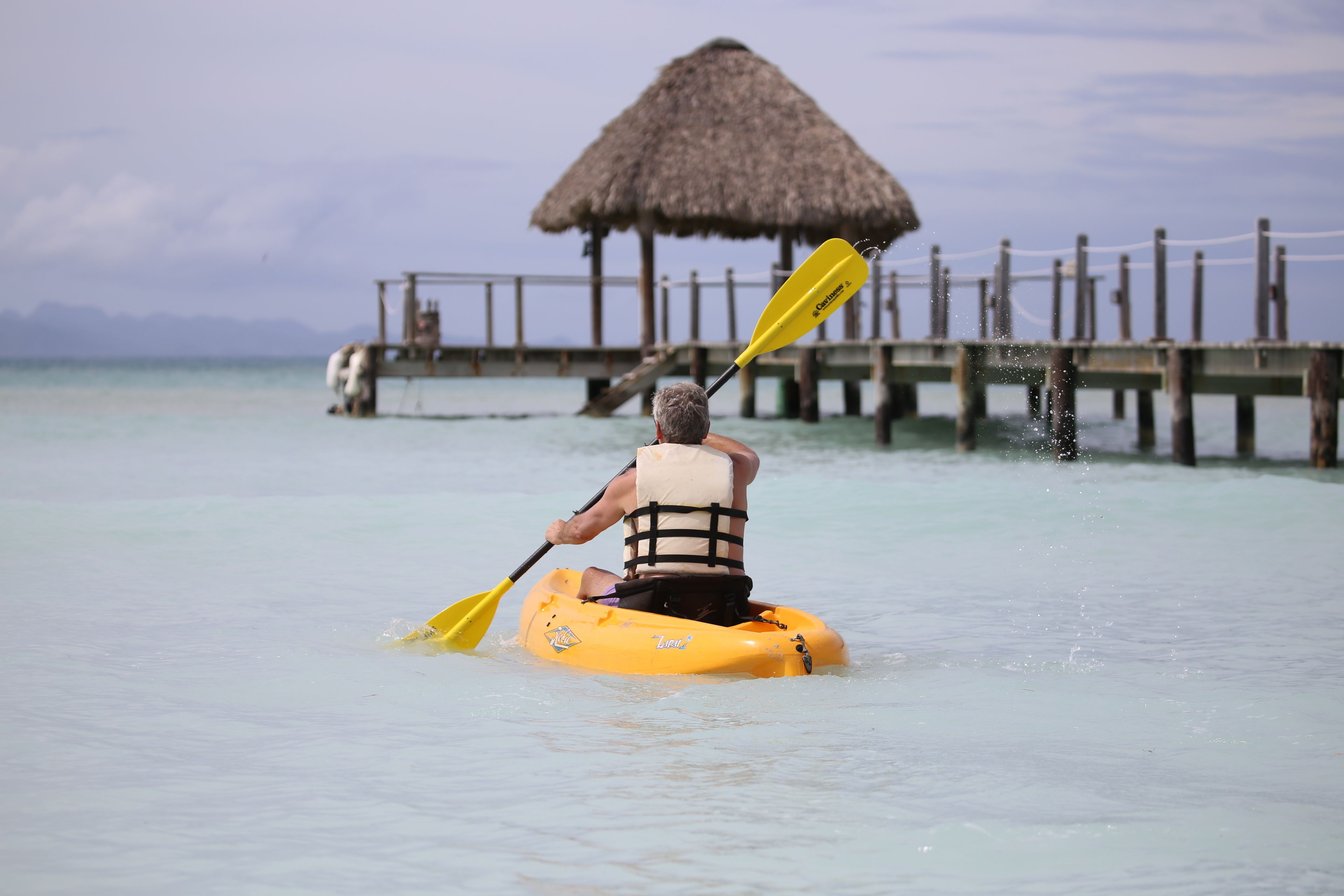 on the beach, white sand, beach umbrellas, beach towels