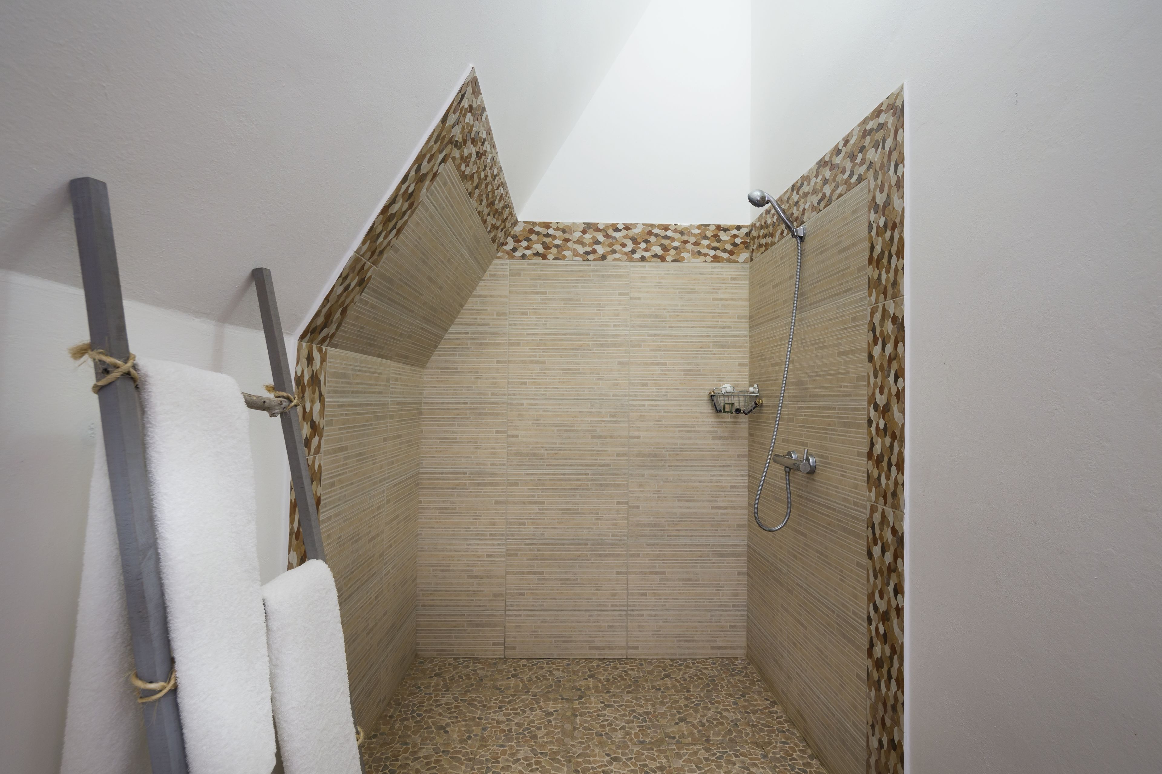 family suite | bathroom | shower, rainfall showerhead, designer toiletries, towels