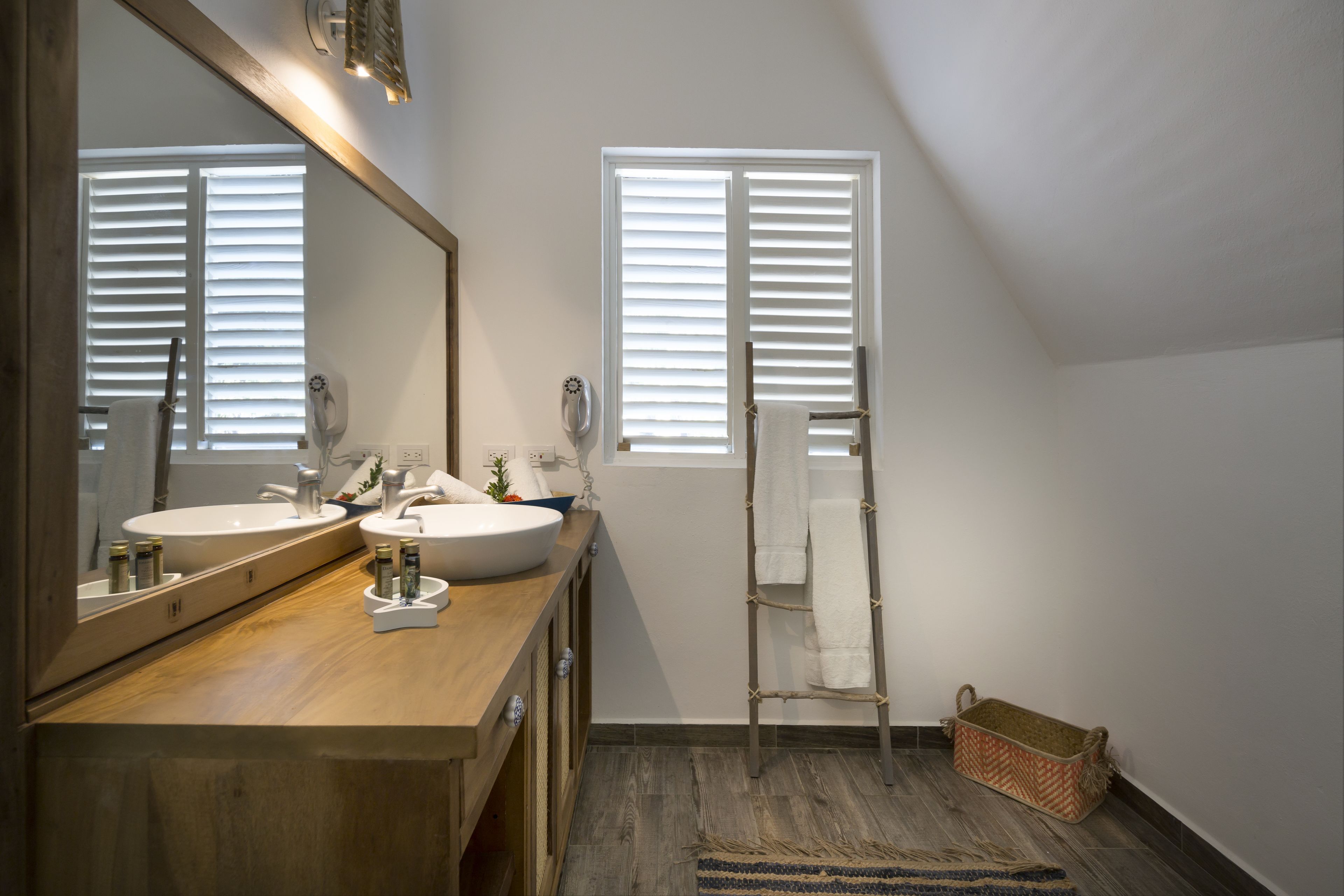 ocean front deluxe bungalow | bathroom | shower, rainfall showerhead, designer toiletries, towels