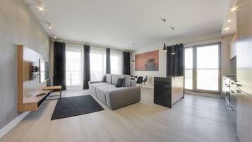 Deluxe Apartment, 2 Bedrooms (10 people) | Living area | 42-inch LCD TV with cable channels, TV