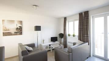 Apartment, 2 Bedrooms | Living room | Flat-screen TV
