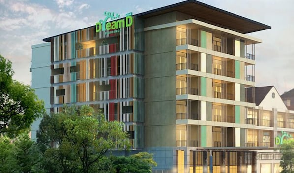 A multi-story hotel with a modern design, featuring balconies on each floor and a prominent green sign with the name "DreamD". - Dream D Residence (Phetchaburi)