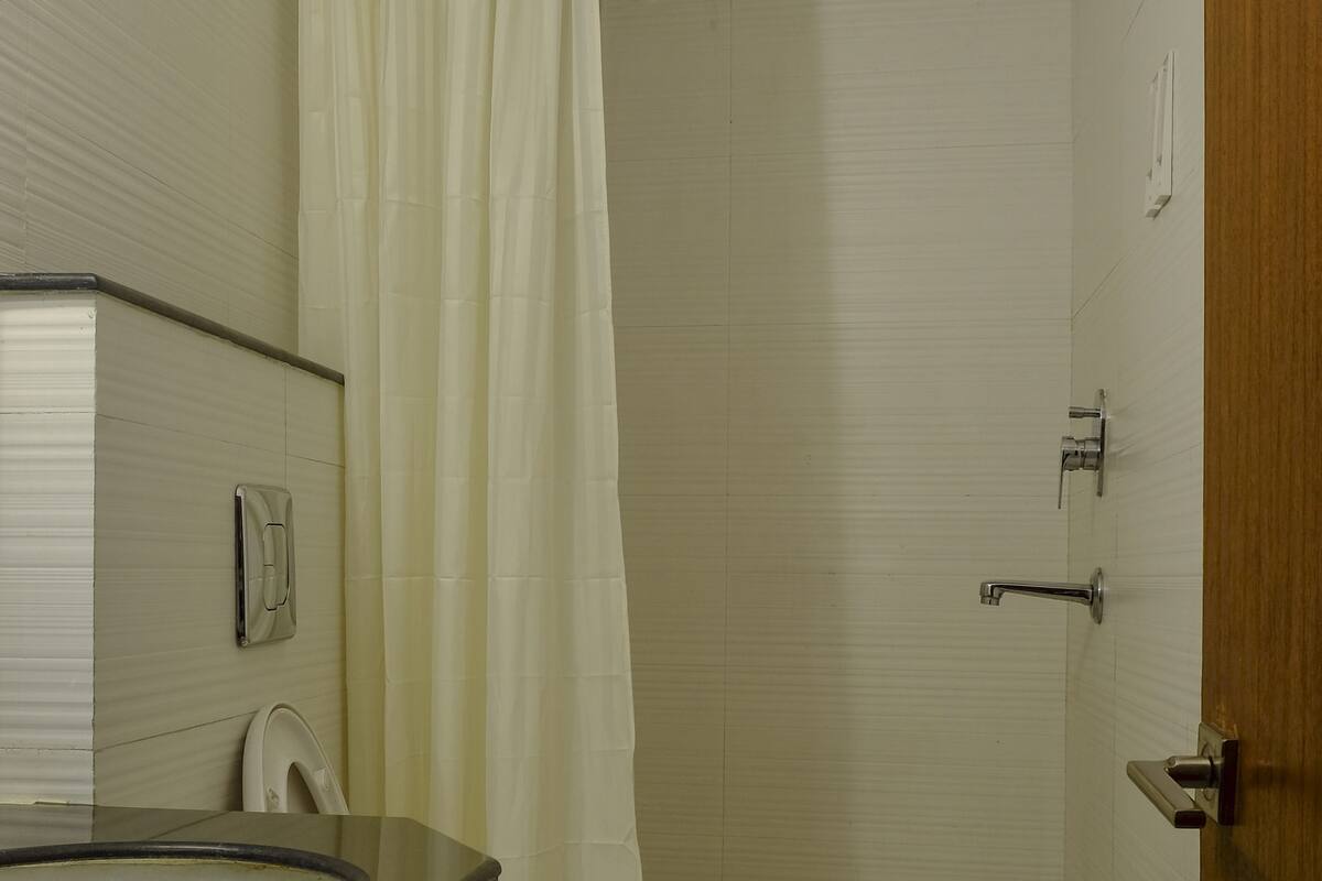 shower, free toiletries, slippers, towels