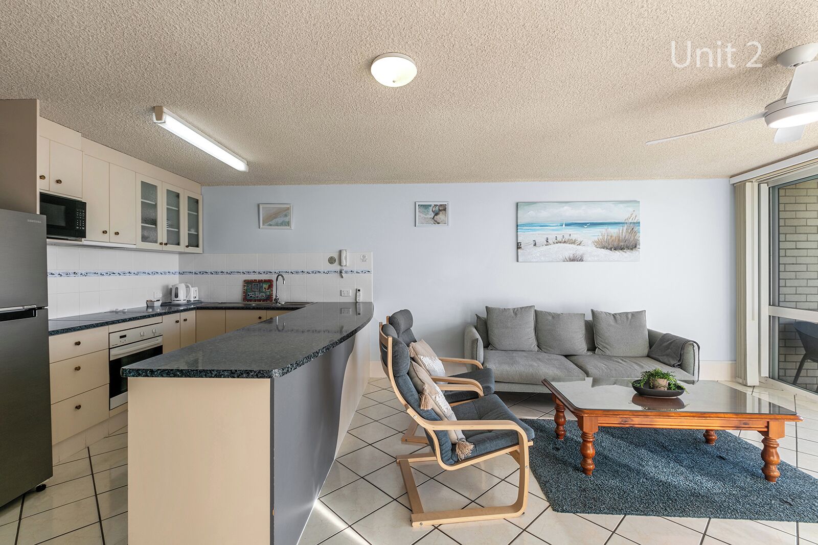 A compact living space with a kitchen, dining area, and seating.