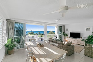 Deluxe 3 Bedroom Ocean View Apartment | Living area | Flat-screen TV, DVD player
