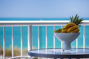 Fresh fruit served on a round table with a view.
