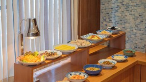 A buffet table with various dishes and bowls of food. - Central Hotel Takeo Onsen (Takeo)