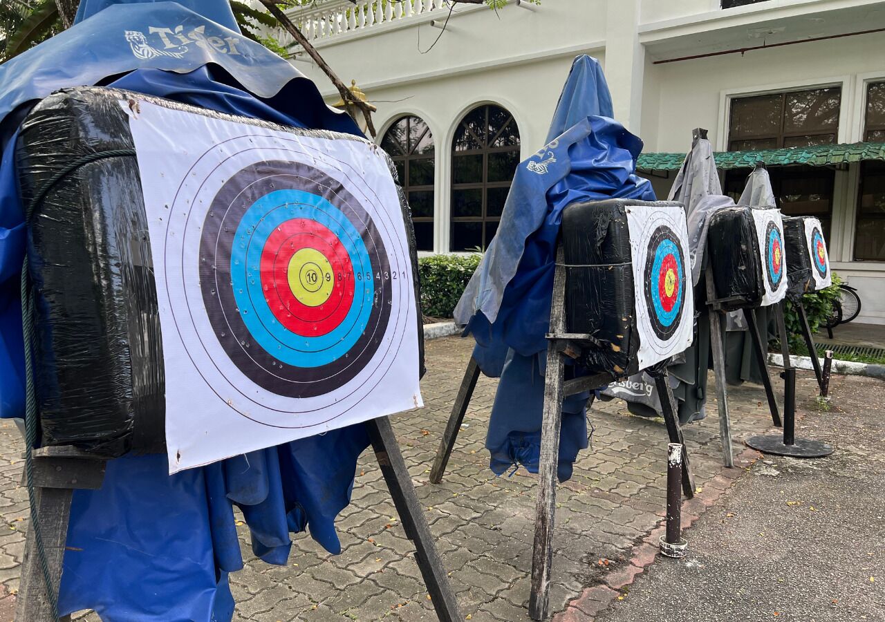 A row of archery targets set up outdoors, likely for a sporting event.